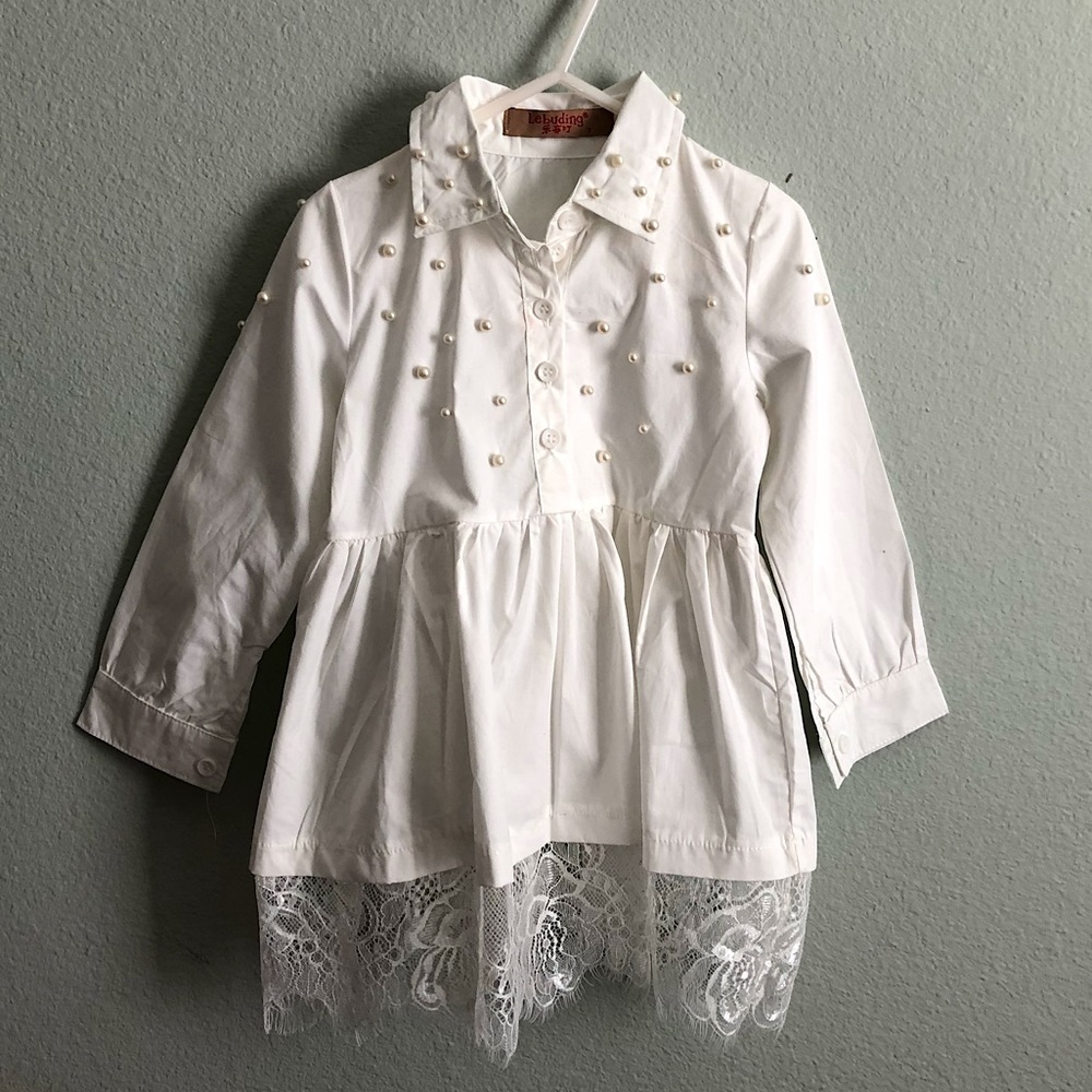 White blouse with pearl embellishments